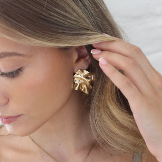 STATEMENT ABSTRACT GOLD STUDS